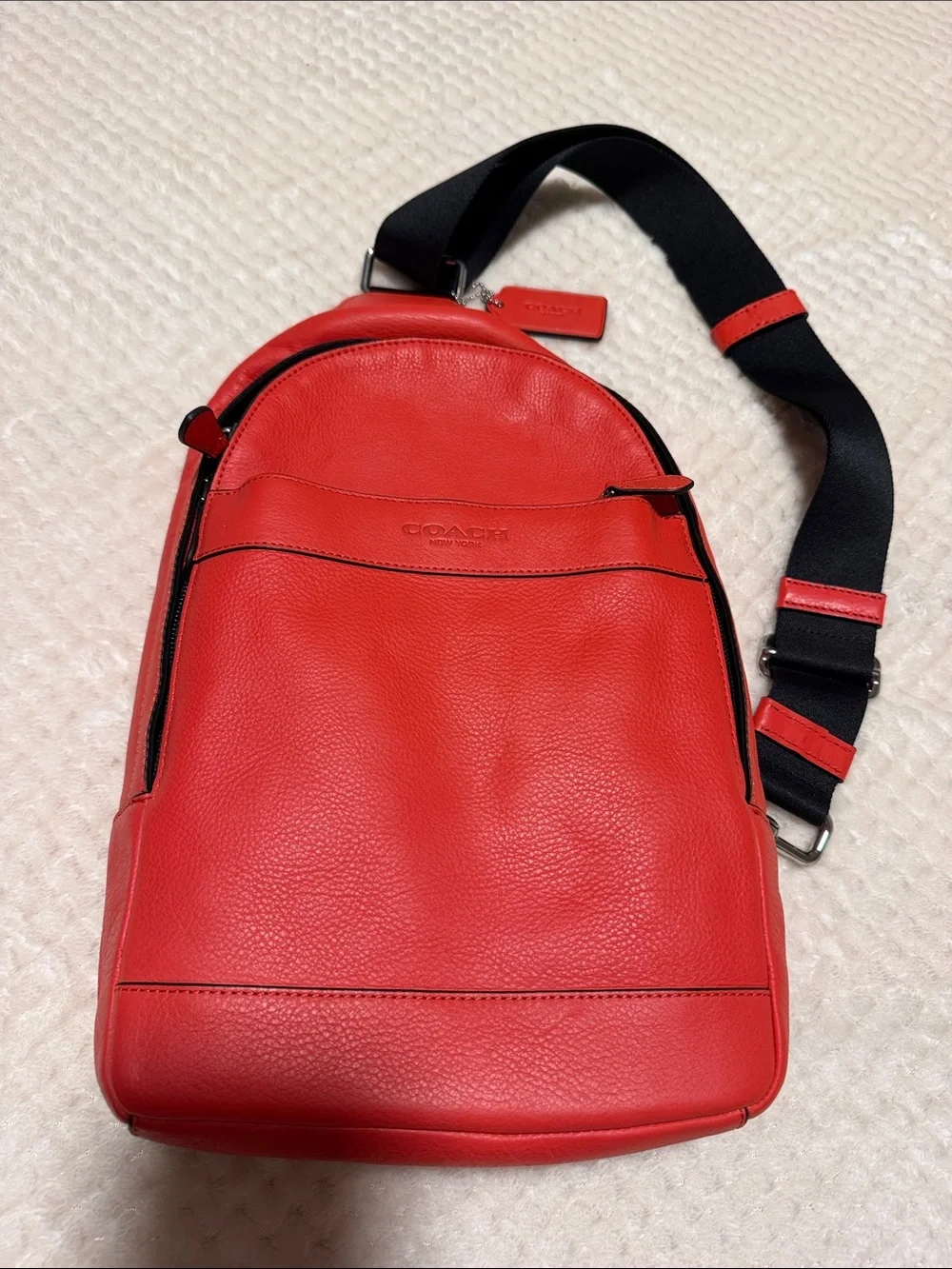 NWT Coach Orange Pebble Leather Crossbody Sling with Black Strap